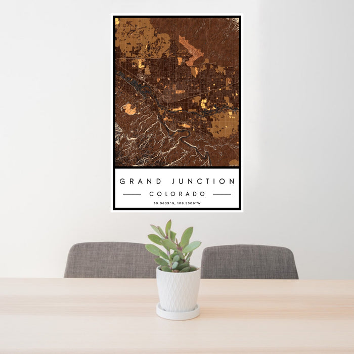 24x36 Grand Junction Colorado Map Print Portrait Orientation in Ember Style Behind 2 Chairs Table and Potted Plant