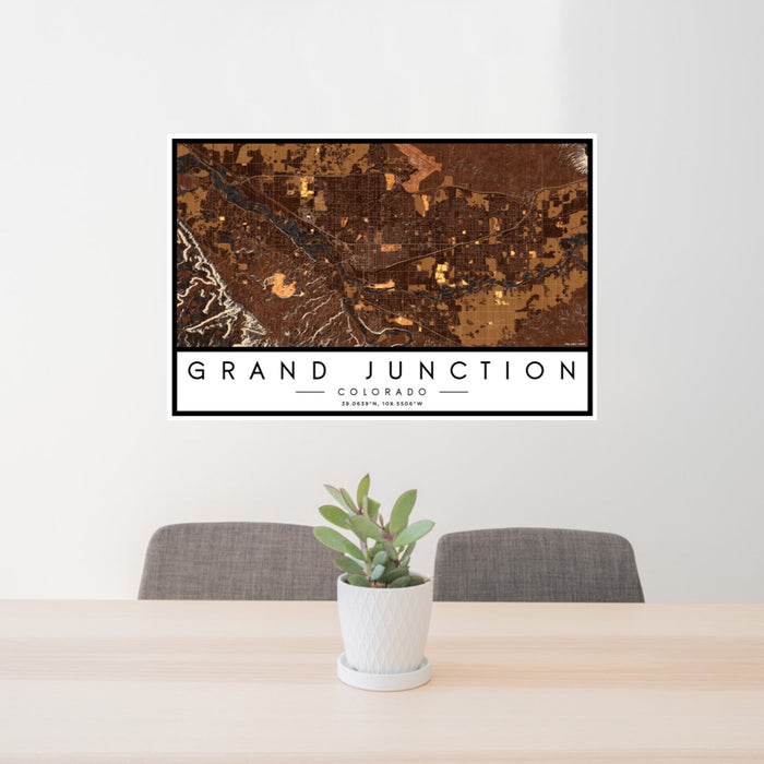 24x36 Grand Junction Colorado Map Print Landscape Orientation in Ember Style Behind 2 Chairs Table and Potted Plant