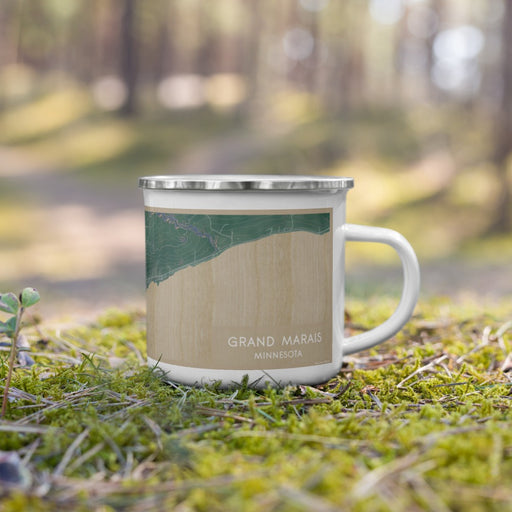 Right View Custom Grand Marais Minnesota Map Enamel Mug in Afternoon on Grass With Trees in Background
