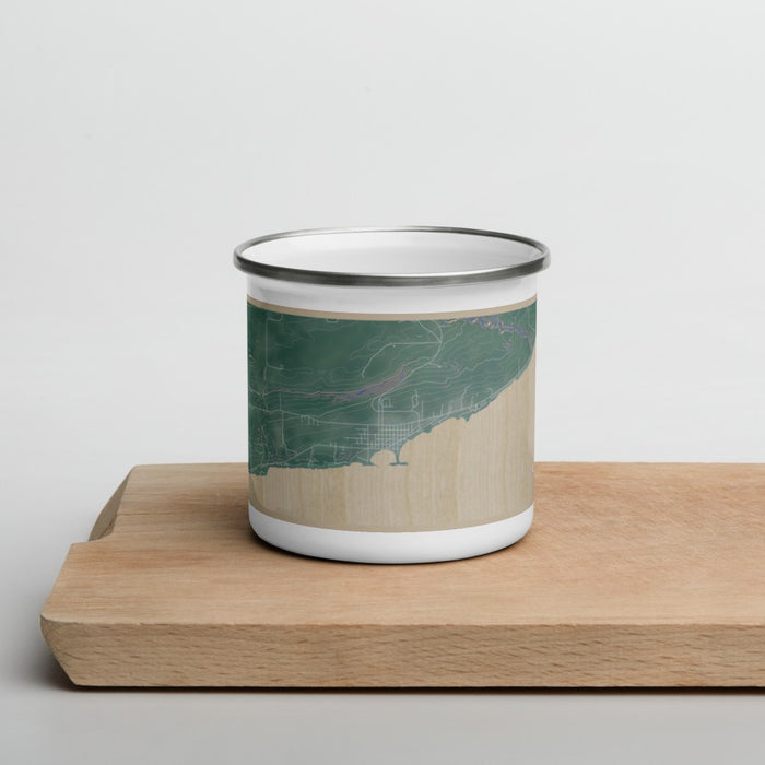 Front View Custom Grand Marais Minnesota Map Enamel Mug in Afternoon on Cutting Board