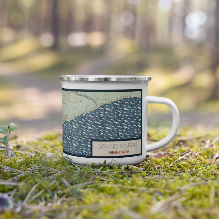 Right View Custom Grand Marais Minnesota Map Enamel Mug in Woodblock on Grass With Trees in Background