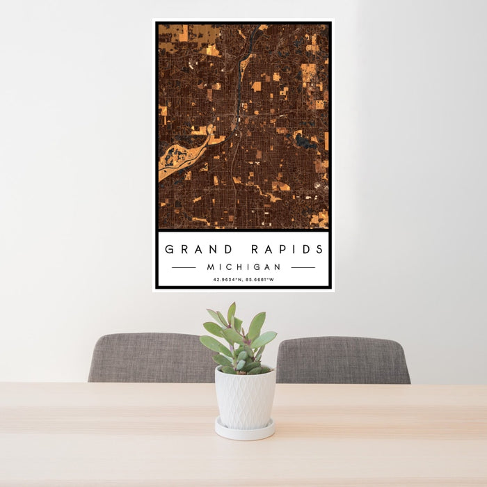 24x36 Grand Rapids Michigan Map Print Portrait Orientation in Ember Style Behind 2 Chairs Table and Potted Plant