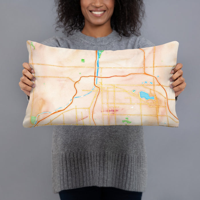 Person holding 20x12 Custom Grand Rapids Michigan Map Throw Pillow in Watercolor
