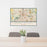 24x36 Grand Rapids Michigan Map Print Landscape Orientation in Woodblock Style Behind 2 Chairs Table and Potted Plant