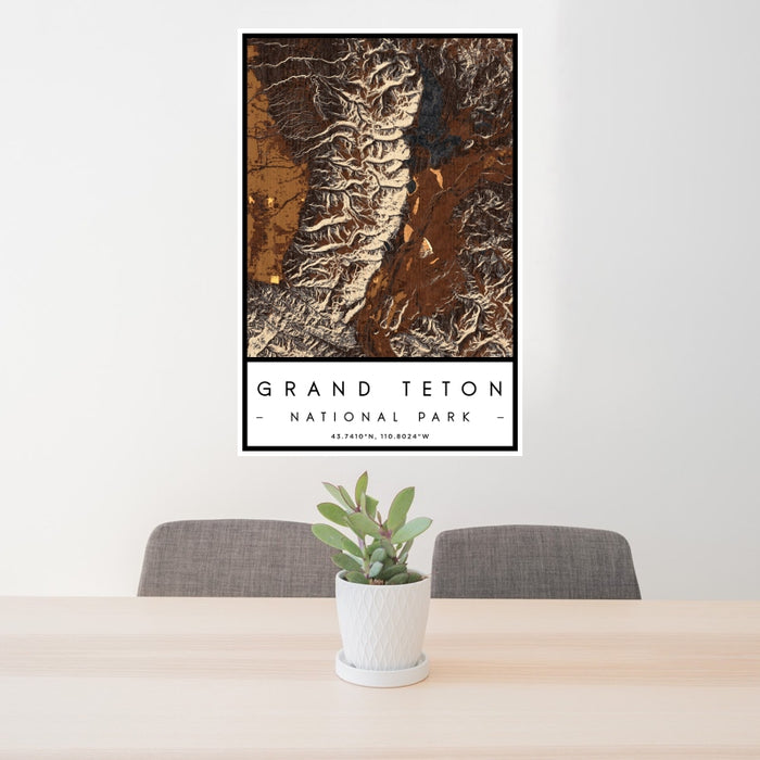 24x36 Grand Teton National Park Map Print Portrait Orientation in Ember Style Behind 2 Chairs Table and Potted Plant
