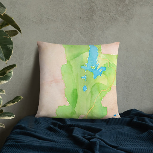 Custom Grand Teton National Park Map Throw Pillow in Watercolor on Bedding Against Wall