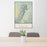 24x36 Grand Teton National Park Map Print Portrait Orientation in Woodblock Style Behind 2 Chairs Table and Potted Plant