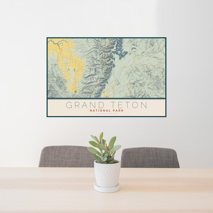 24x36 Grand Teton National Park Map Print Landscape Orientation in Woodblock Style Behind 2 Chairs Table and Potted Plant