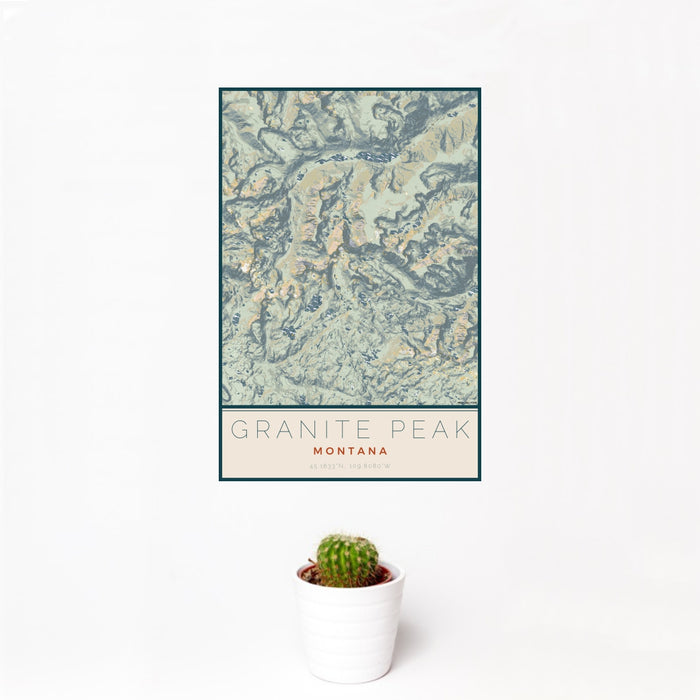 12x18 Granite Peak Montana Map Print Portrait Orientation in Woodblock Style With Small Cactus Plant in White Planter