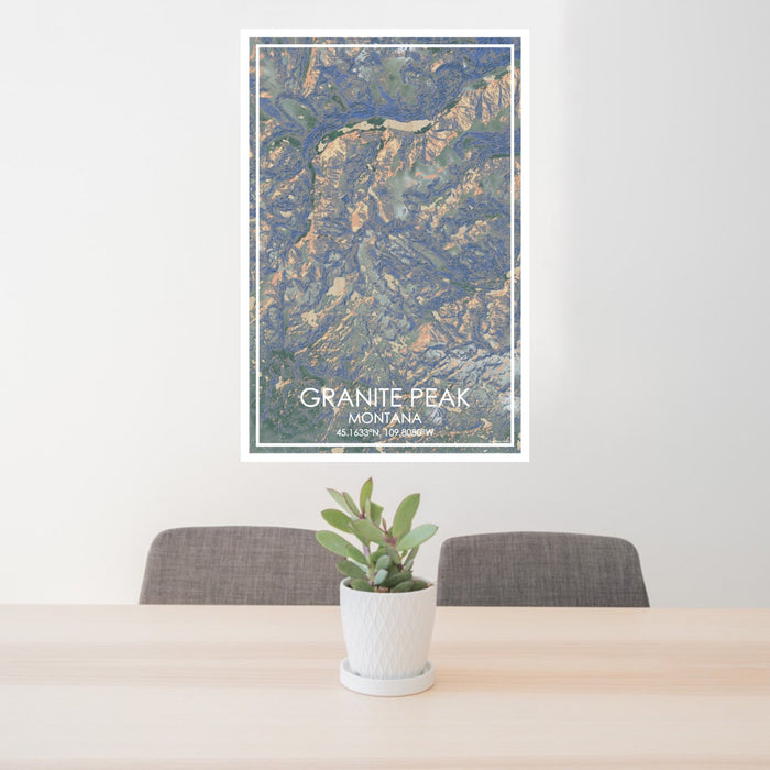 24x36 Granite Peak Montana Map Print Portrait Orientation in Afternoon Style Behind 2 Chairs Table and Potted Plant