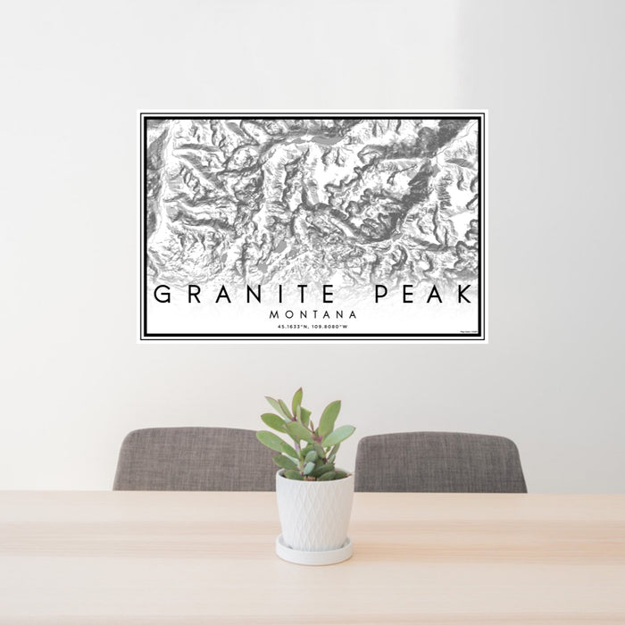 24x36 Granite Peak Montana Map Print Lanscape Orientation in Classic Style Behind 2 Chairs Table and Potted Plant
