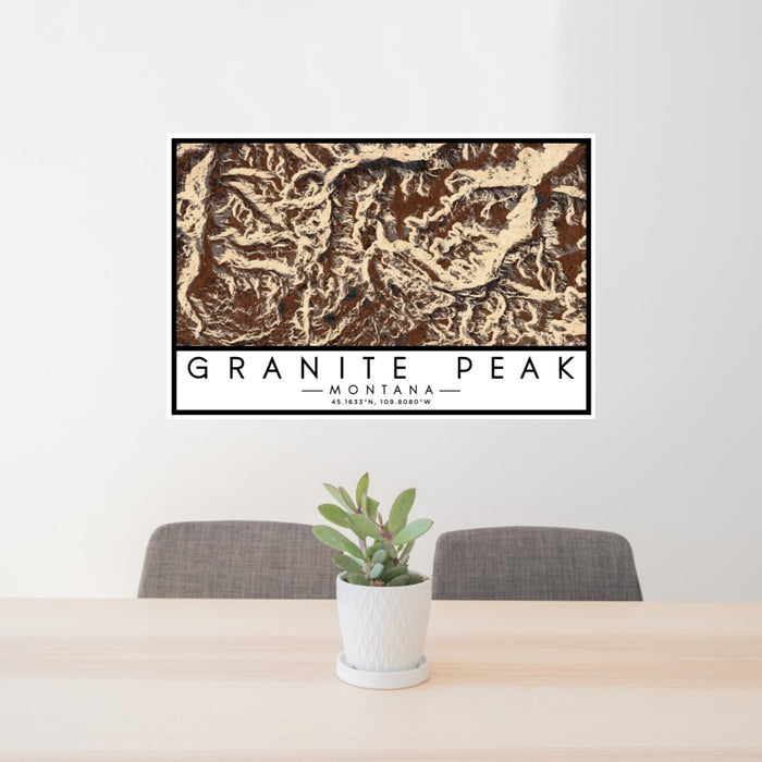 24x36 Granite Peak Montana Map Print Lanscape Orientation in Ember Style Behind 2 Chairs Table and Potted Plant