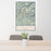 24x36 Granite Peak Montana Map Print Portrait Orientation in Woodblock Style Behind 2 Chairs Table and Potted Plant