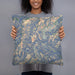 Person holding 18x18 Custom Granite Peak Montana Map Throw Pillow in Afternoon