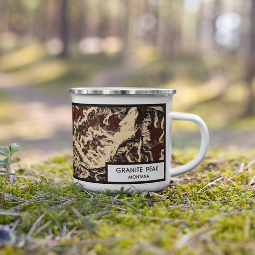 Right View Custom Granite Peak Montana Map Enamel Mug in Ember on Grass With Trees in Background