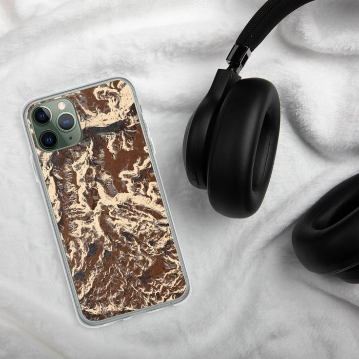 Custom Granite Peak Montana Map Phone Case in Ember on Table with Black Headphones