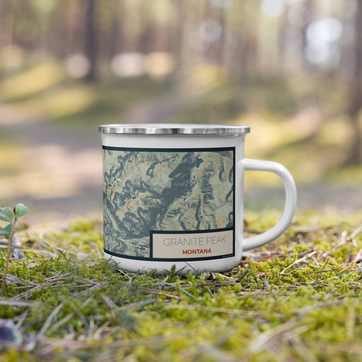 Right View Custom Granite Peak Montana Map Enamel Mug in Woodblock on Grass With Trees in Background
