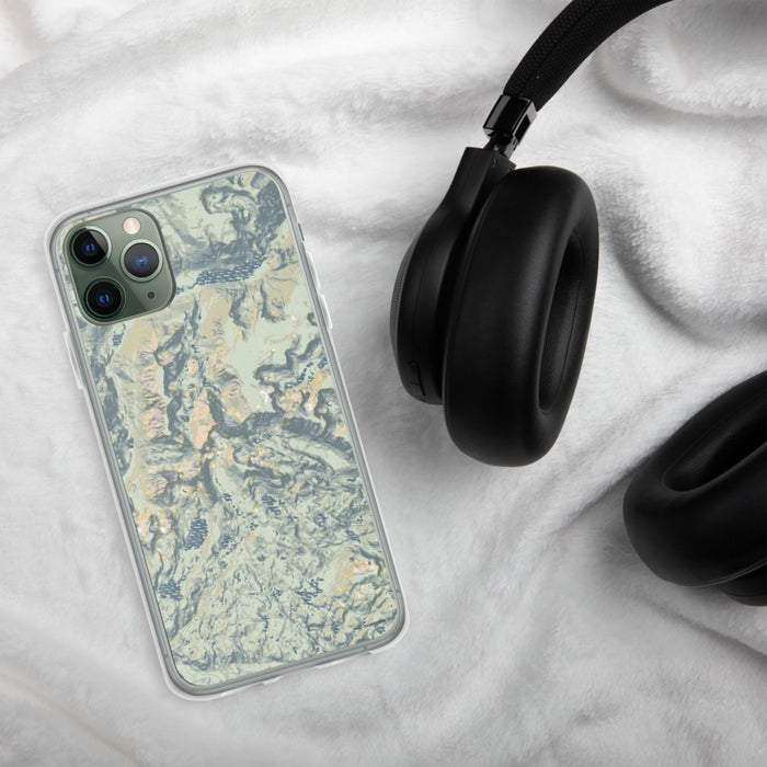 Custom Granite Peak Montana Map Phone Case in Woodblock on Table with Black Headphones