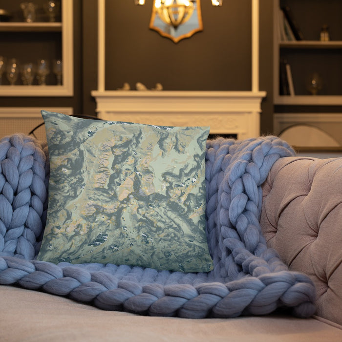 Custom Granite Peak Montana Map Throw Pillow in Woodblock on Cream Colored Couch