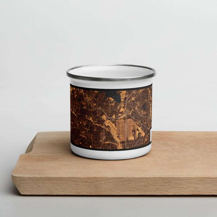 Front View Custom Grapevine Texas Map Enamel Mug in Ember on Cutting Board