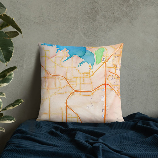 Custom Grapevine Texas Map Throw Pillow in Watercolor on Bedding Against Wall