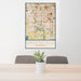 24x36 Greenfield Wisconsin Map Print Portrait Orientation in Woodblock Style Behind 2 Chairs Table and Potted Plant