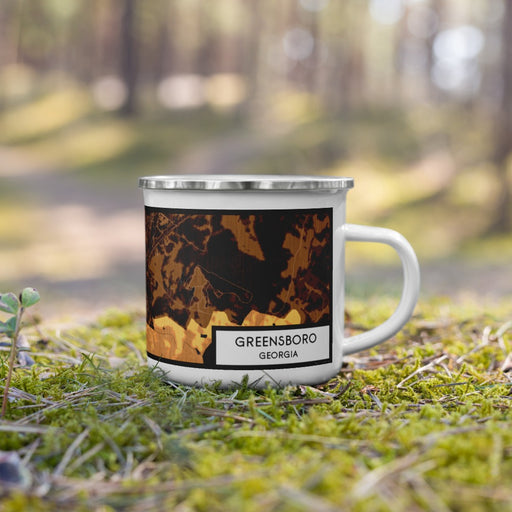 Right View Custom Greensboro Georgia Map Enamel Mug in Ember on Grass With Trees in Background