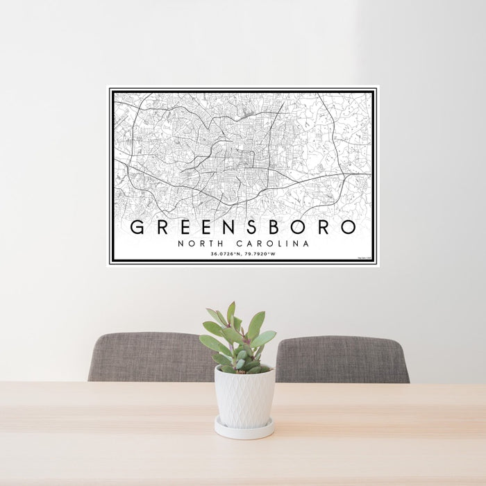 24x36 Greensboro North Carolina Map Print Landscape Orientation in Classic Style Behind 2 Chairs Table and Potted Plant