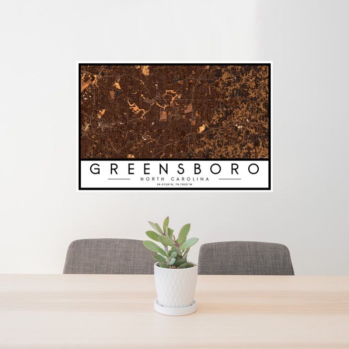 24x36 Greensboro North Carolina Map Print Landscape Orientation in Ember Style Behind 2 Chairs Table and Potted Plant