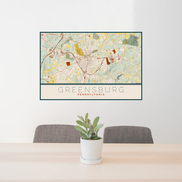 24x36 Greensburg Pennsylvania Map Print Lanscape Orientation in Woodblock Style Behind 2 Chairs Table and Potted Plant