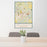 24x36 Greensburg Pennsylvania Map Print Portrait Orientation in Woodblock Style Behind 2 Chairs Table and Potted Plant