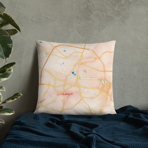 Custom Greenville North Carolina Map Throw Pillow in Watercolor on Bedding Against Wall