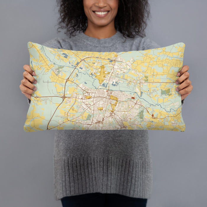 Person holding 20x12 Custom Greenville North Carolina Map Throw Pillow in Woodblock