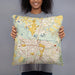 Person holding 18x18 Custom Greenville North Carolina Map Throw Pillow in Woodblock