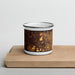 Front View Custom Greenwood Indiana Map Enamel Mug in Ember on Cutting Board
