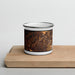 Front View Custom Gruene Texas Map Enamel Mug in Ember on Cutting Board