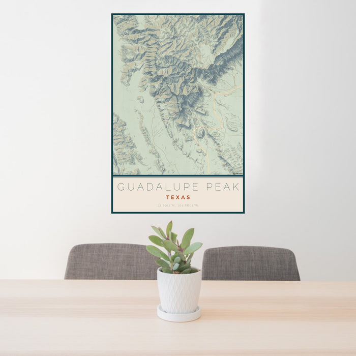 24x36 Guadalupe Peak Texas Map Print Portrait Orientation in Woodblock Style Behind 2 Chairs Table and Potted Plant
