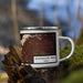 Right View Custom Guadalupe Peak Texas Map Enamel Mug in Ember on Grass With Trees in Background