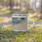 Right View Custom Gulf Shores Alabama Map Enamel Mug in Afternoon on Grass With Trees in Background