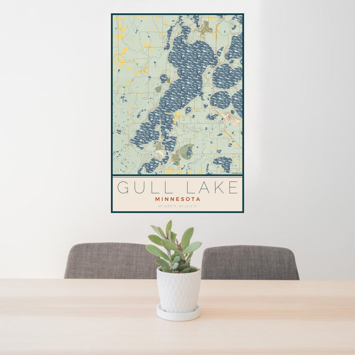 24x36 Gull Lake Minnesota Map Print Portrait Orientation in Woodblock Style Behind 2 Chairs Table and Potted Plant