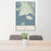 24x36 Gustavus Alaska Map Print Portrait Orientation in Woodblock Style Behind 2 Chairs Table and Potted Plant