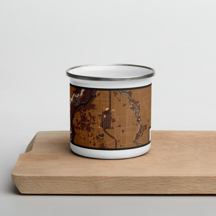 Front View Custom Hagerman Idaho Map Enamel Mug in Ember on Cutting Board