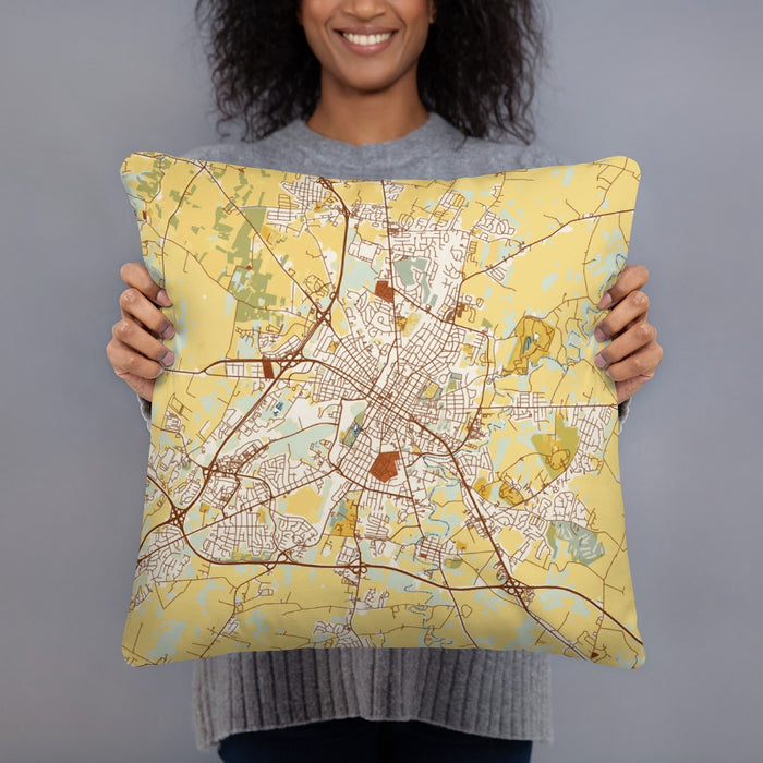 Person holding 18x18 Custom Hagerstown Maryland Map Throw Pillow in Woodblock