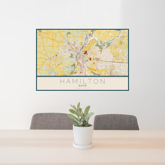 24x36 Hamilton Ohio Map Print Landscape Orientation in Woodblock Style Behind 2 Chairs Table and Potted Plant