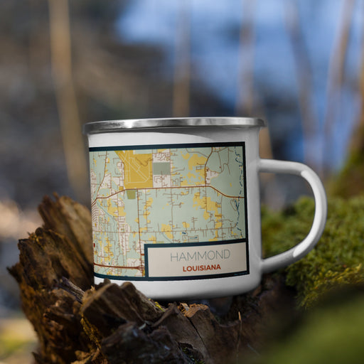 Right View Custom Hammond Louisiana Map Enamel Mug in Woodblock on Grass With Trees in Background