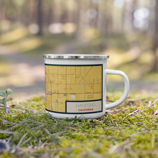 Right View Custom Hanford California Map Enamel Mug in Woodblock on Grass With Trees in Background