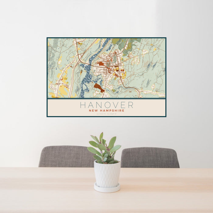 24x36 Hanover New Hampshire Map Print Landscape Orientation in Woodblock Style Behind 2 Chairs Table and Potted Plant
