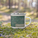 Right View Custom Harrisonville Missouri Map Enamel Mug in Afternoon on Grass With Trees in Background