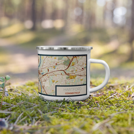 Right View Custom Hartford Connecticut Map Enamel Mug in Woodblock on Grass With Trees in Background