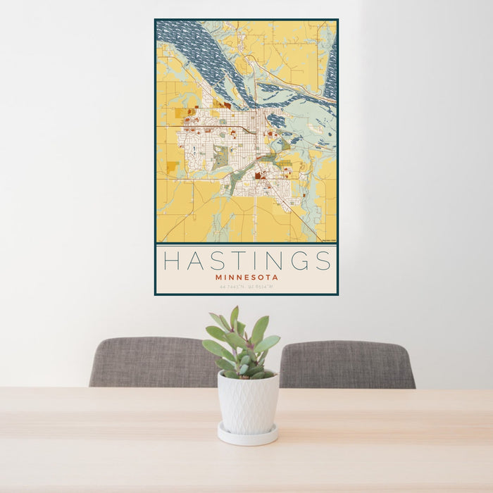 24x36 Hastings Minnesota Map Print Portrait Orientation in Woodblock Style Behind 2 Chairs Table and Potted Plant